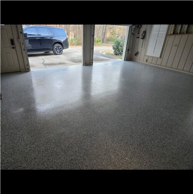 Garage with flake epoxy floor, door open